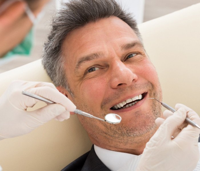 Man smiling in the dental chair