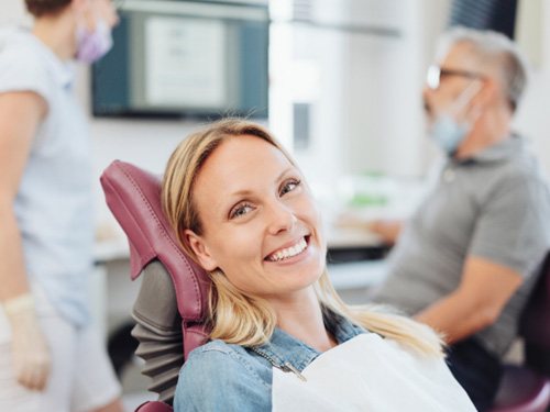 Woman smiling in the dental chair