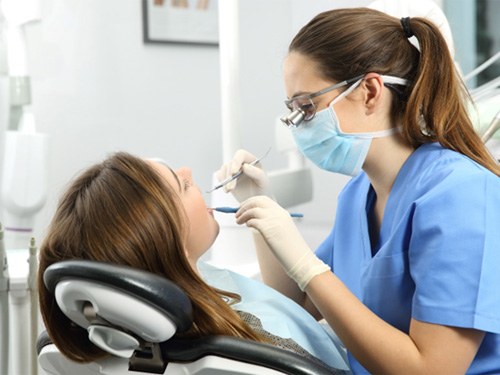 Woman having her teeth cleaned
