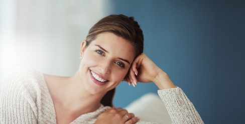 Smiling woman in white sweater