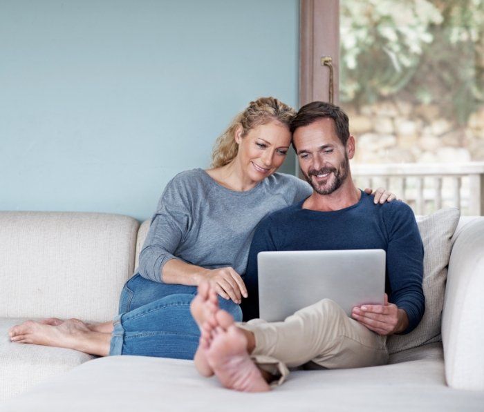 Man and woman looking at tablet